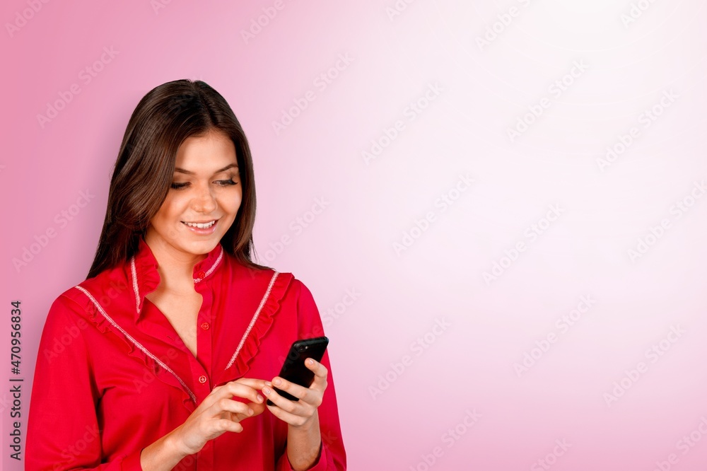 Happy beautiful cute young woman teen smiling excited typing text message on smart mobile Happy beautiful cute young woman teen smiling excited typing text message on smart mobile