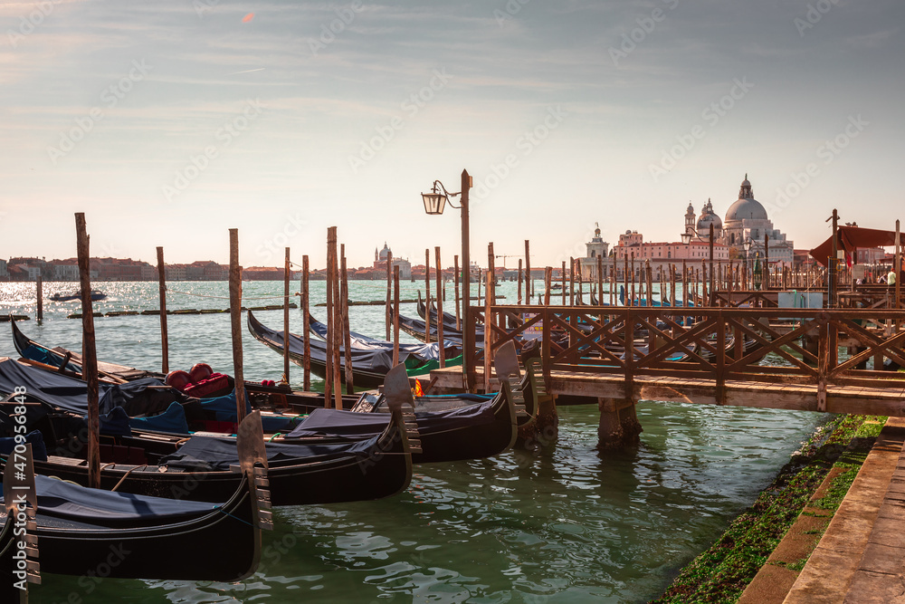 Gondolas parked at Venezia with San Giorgio Maggiore church at the back, Veneto, Italy.