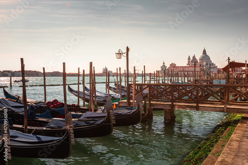 Gondolas parked at Venezia with San Giorgio Maggiore church at the back, Veneto, Italy.