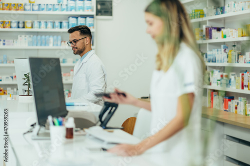 Portrait of a handsome male pharmacist working in a pharmacy