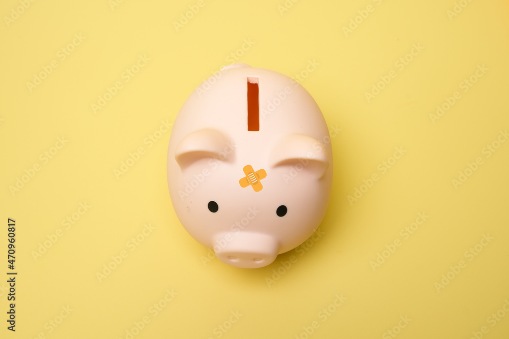 A picture of piggy bank on isolated yellow background. Smart saver and financial goal concept. A picture of piggy bank on isolated yellow background. Smart saver and financial goal concept.
