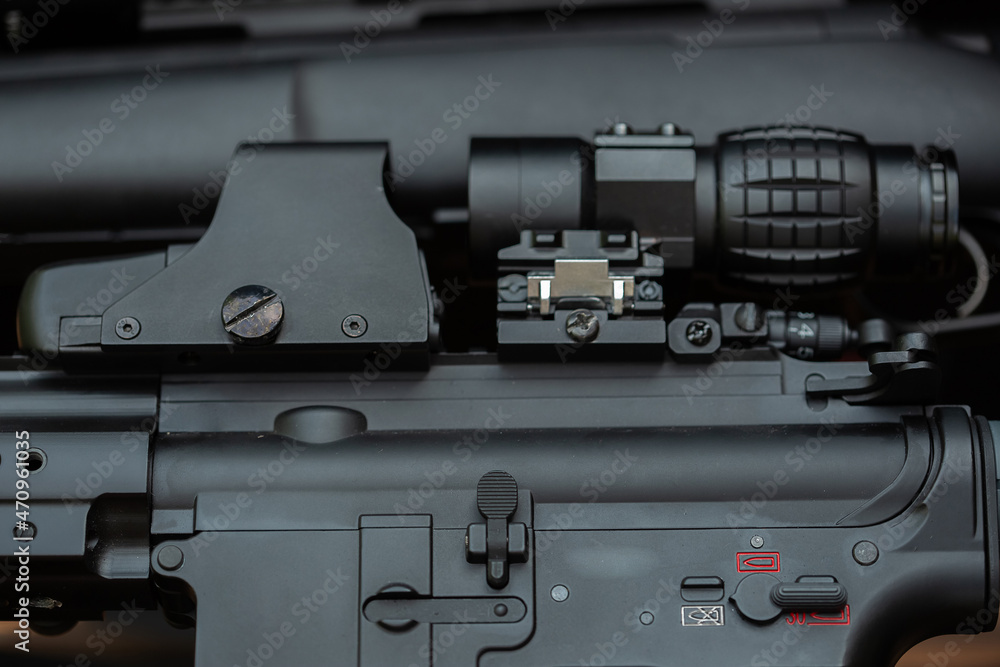 Close-up parts of automatic weapon with selective focus and blurred background Close-up parts of automatic weapon with selective focus and blurred background