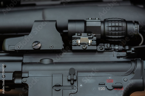 Close-up parts of automatic weapon with selective focus and blurred background