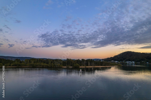 Sunrise aerial waterscape over the bay with cloud cover