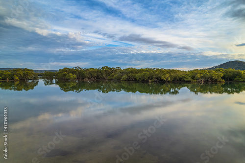 Clouds and reflections early morning waterscape © Merrillie