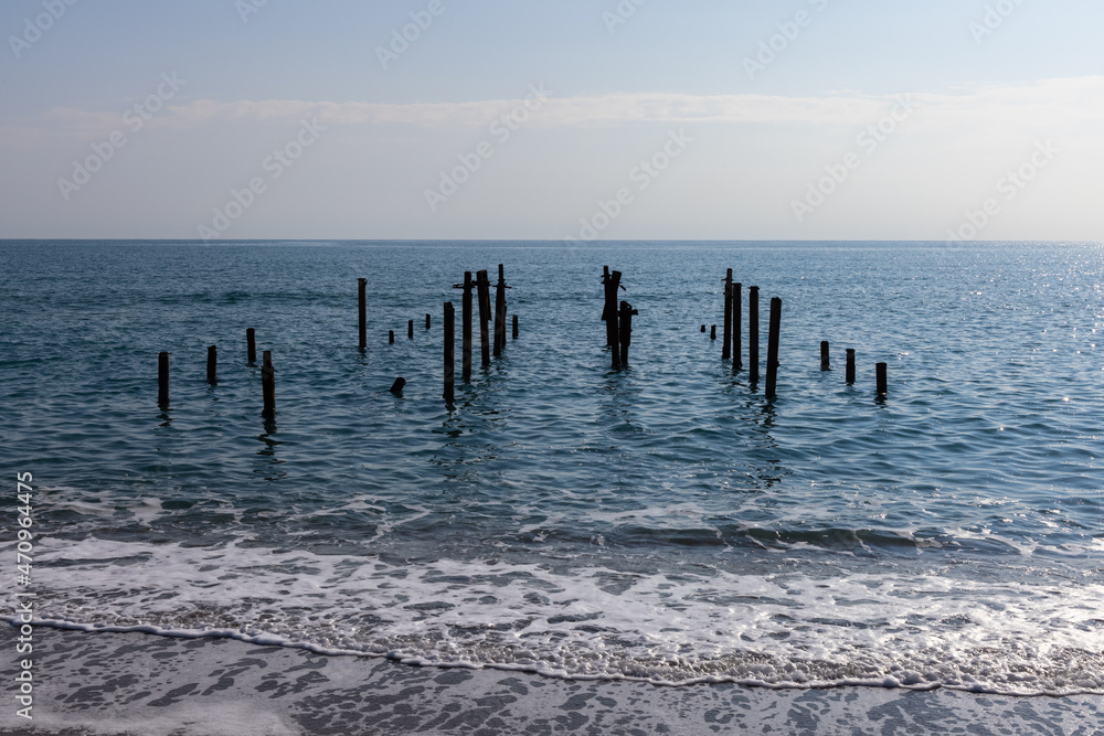 ruins of an old pier in the sea