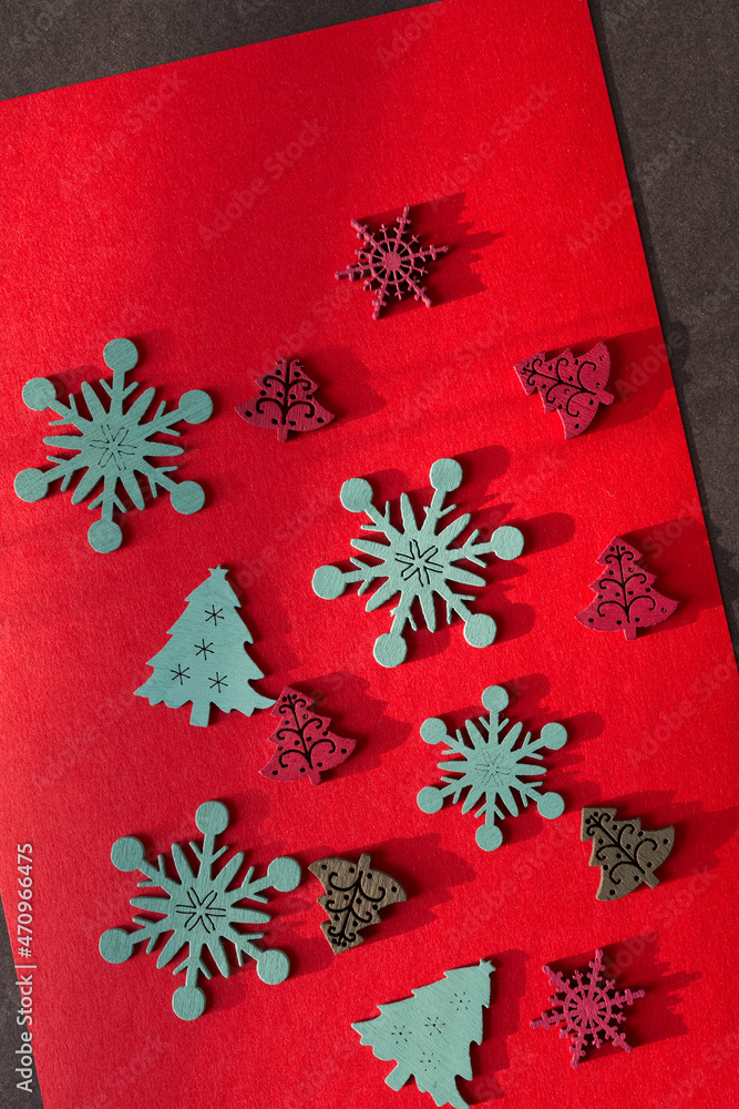 retro christmas wooden decorations on paper - photographed with descriptive, raking or low light retro christmas wooden decorations on paper - photographed with descriptive, raking or low light