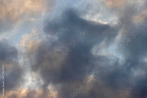 Beautiful clouds of different colors in the sky, background for design.