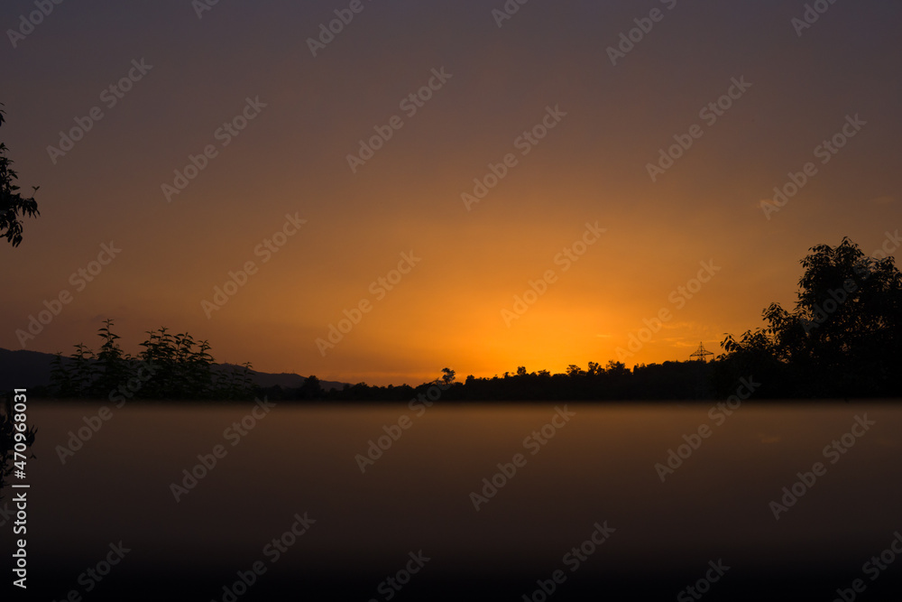 Beautiful sunset photo with reflection in golden hour