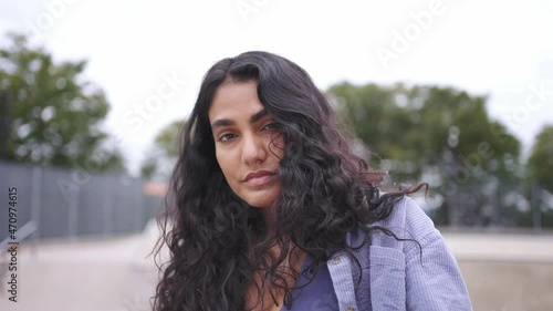 Portrait of young mixed race millennial girl in New York City. Urban modern student lifestyle, hipster fashion in NYC, skater model, multi-ethnic hispanic American. skateboarder hipster at skatepark.