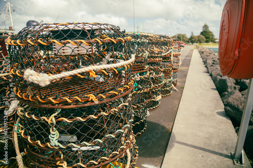 Cray pots lined stacked on jetty at the Port of Portland in Victoria Australia