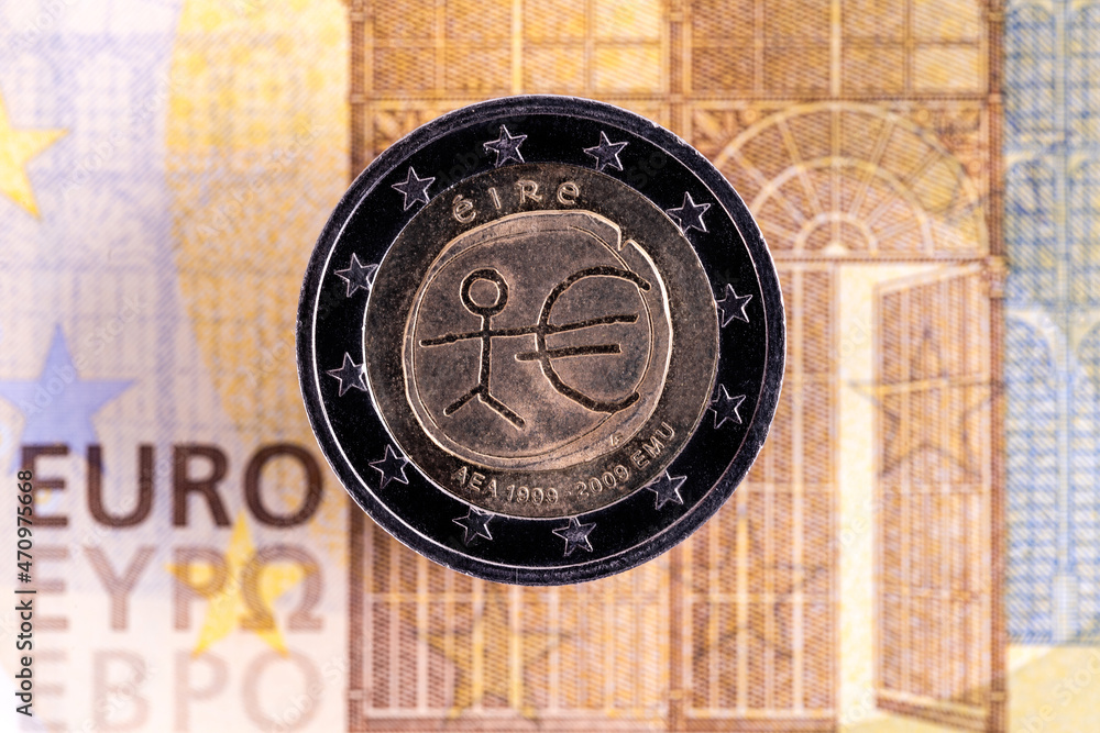 2 euro coin and a fragment of a 200 euro note close-up