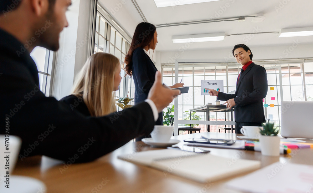 Fototapeta premium Group of diverse colleagues brainstorming in boardroom