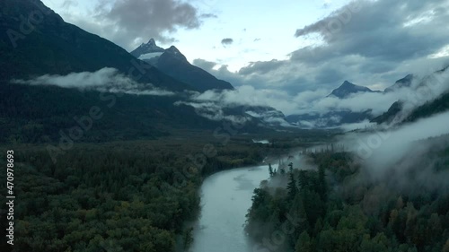 Dramatic aerial landscape view of British Colombia with river and fog, Canada photo