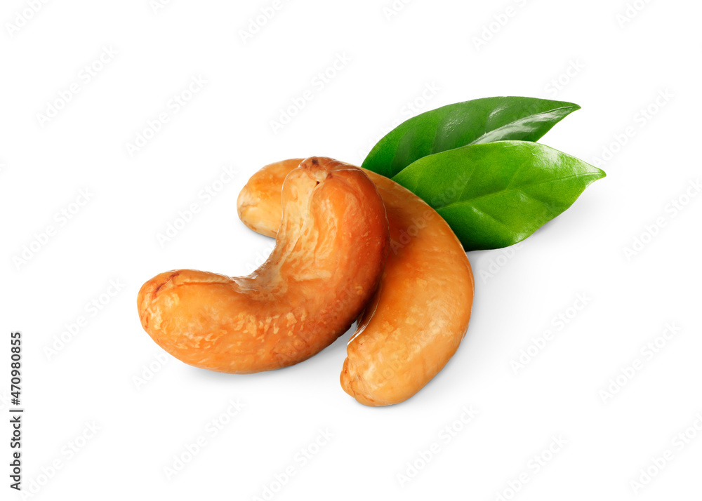 Tasty cashew nuts and fresh green leaves on white background Tasty cashew nuts and fresh green leaves on white background