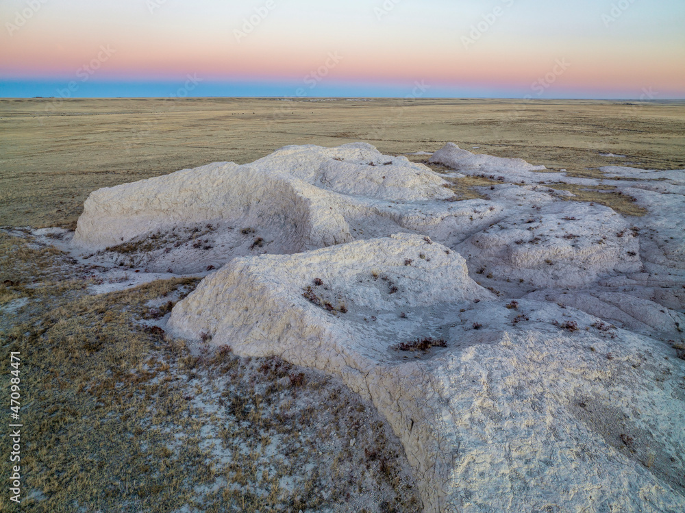 dusk over badlands and prairie in Pawnee National Grassland in northern Colorado, fall scenery aerial view dusk over badlands and prairie in Pawnee National Grassland in northern Colorado, fall scenery aerial view