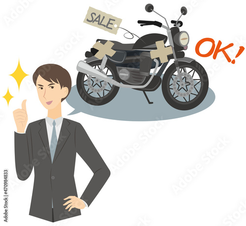 中古のオートバイクの買取をするビジネスマン