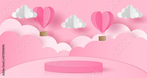 Paper cut of Valentine's Day background with pink cylinder podium, heart hot air balloons and clouds for products display presentation, poster, greeting card