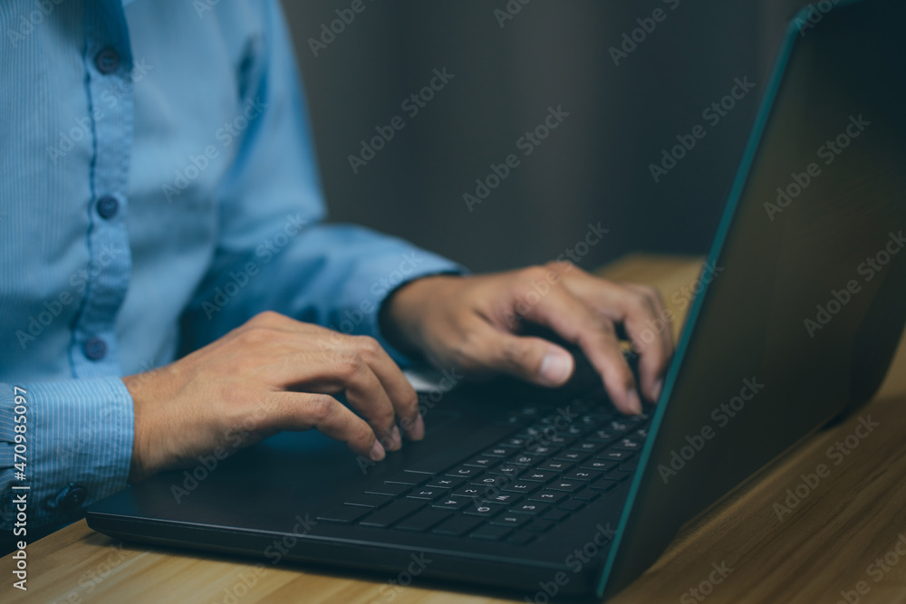 closeup hands of businessman working at office, Man typing keyboard on laptop or computer closeup hands of businessman working at office, Man typing keyboard on laptop or computer