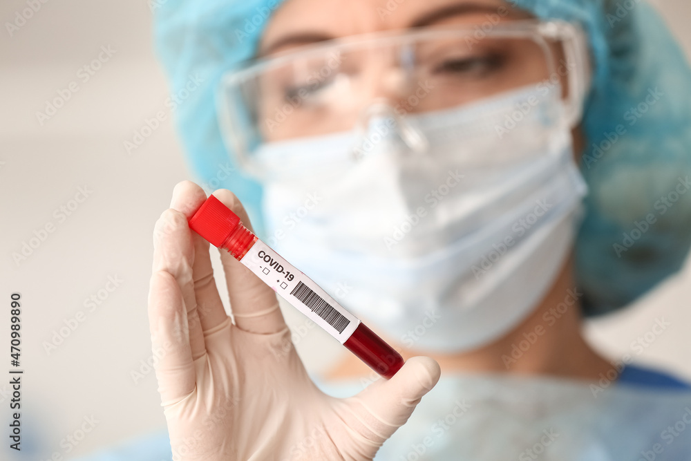 Scientist with sample of covid-19 in laboratory Scientist with sample of covid-19 in laboratory