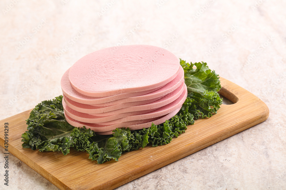 Slices pork sausage over board Slices pork sausage over board