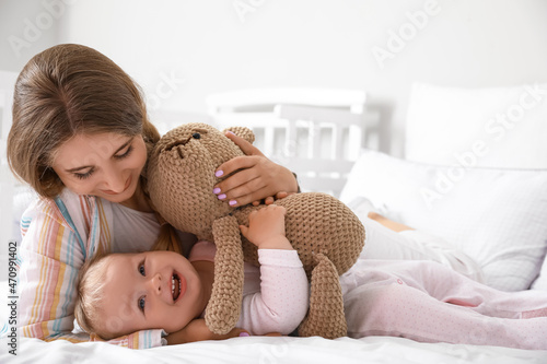 Young mother with her cute ...