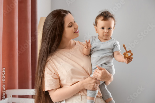 Young mother holding cute l...
