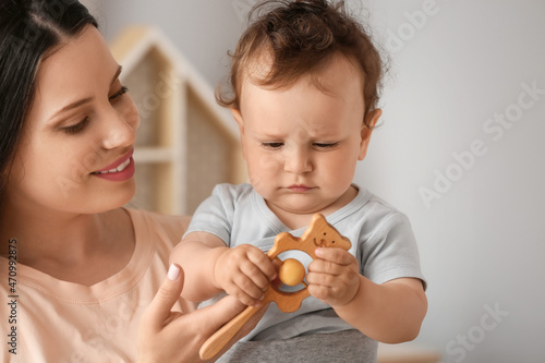 Young mother holding cute l...