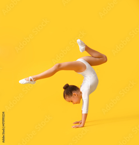 Little girl doing gymnastic...