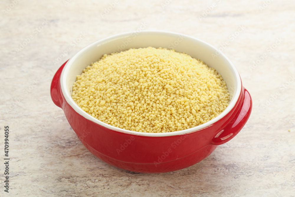 Raw couscous in the bowl Raw couscous in the bowl