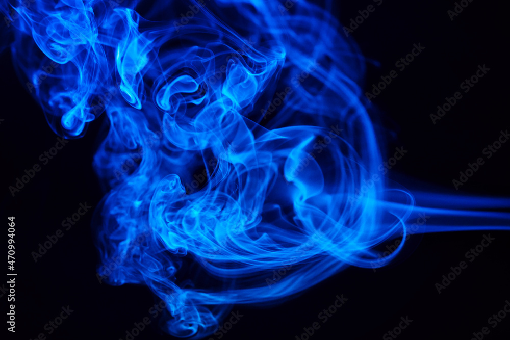 Abstract colored smoke hookah on dark background. Texture. Art Design element. Personal vaporizers fragrant steam. Concept of alternative non-nicotine smoking. E-cigarette. Blurry image, soft focus Abstract colored smoke hookah on dark background. Texture. Art Design element. Personal vaporizers fragrant steam. Concept of alternative non-nicotine smoking. E-cigarette. Blurry image, soft focus
