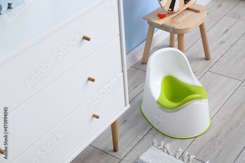 White potty near chest of d...