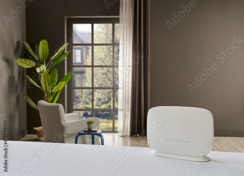 Close up white modem on the table and decorative living room background style.