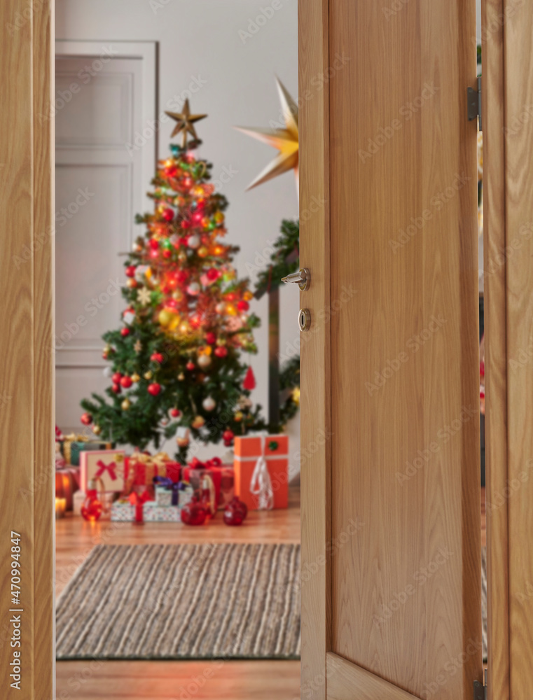 Close up wooden open door style and Christmas tree gift box background, new year concept.