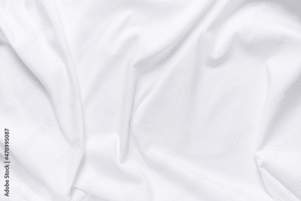 Abstract white fabric texture background. Cloth soft wave. Creases of satin, silk, and cotton. Abstract white fabric texture background. Cloth soft wave. Creases of satin, silk, and cotton.