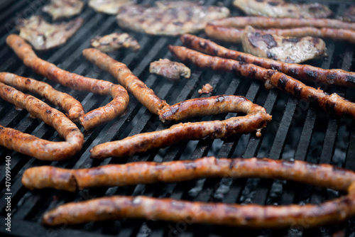 sausages isolated on grill wire. barbecue meat 