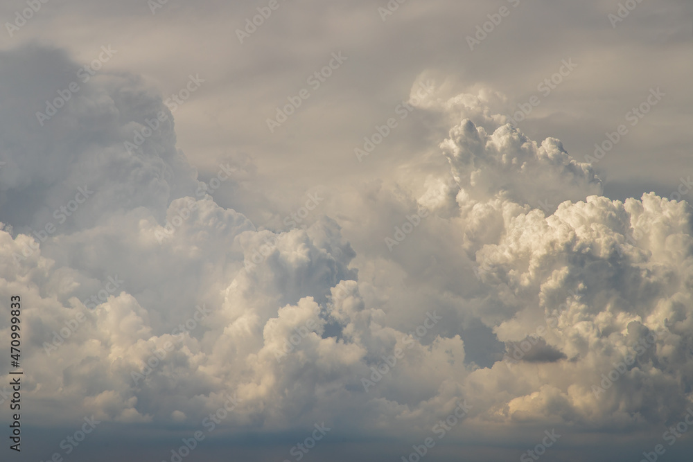 The sun shines through the clouds in the sunset sky with dramatic light. The shape of the clouds evokes imagination and creativity. They can be used as wallpapers that look amazing. Copy space. The sun shines through the clouds in the sunset sky with dramatic light. The shape of the clouds evokes imagination and creativity. They can be used as wallpapers that look amazing. Copy space.