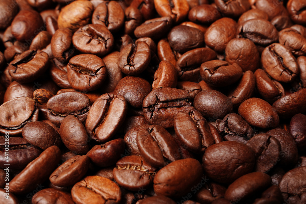 Closeup macro a group roasted brown or black coffee grains background Closeup macro a group roasted brown or black coffee grains background
