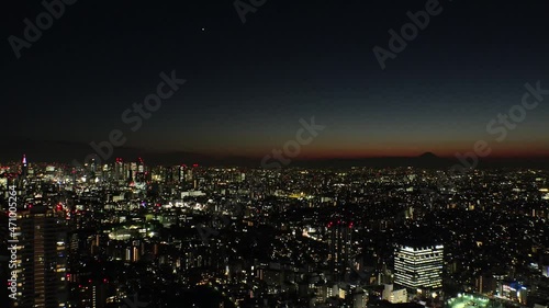 Wallpaper Mural TOKYO, JAPAN : Aerial high angle sunrise CITYSCAPE of TOKYO and MOUNT FUJI. Golden sun rising behind mountains. Japanese city life and nature concept. Long time lapse shot night to morning. Torontodigital.ca