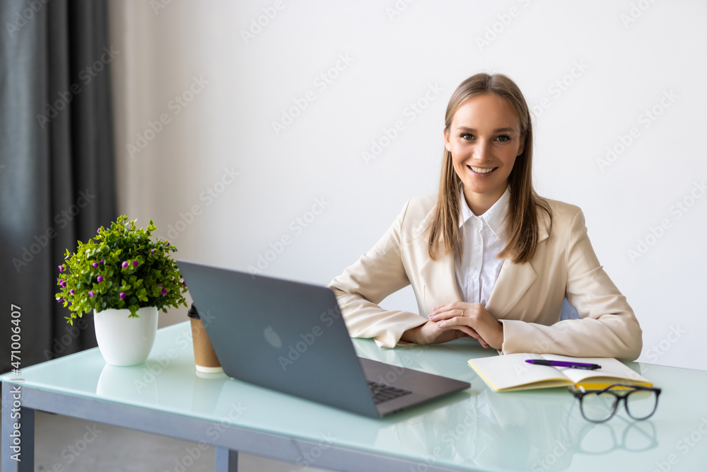 Young business woman with notebook in the office Young business woman with notebook in the office