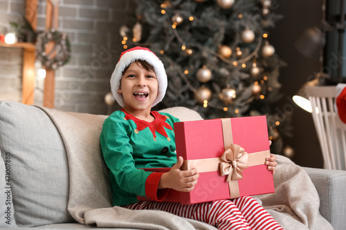 Cute little boy with gift a...