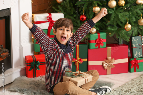 Happy little boy with gift ...