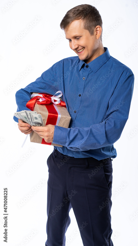 man with gifts and money on a white isolated background rejoices, surprised, laughs