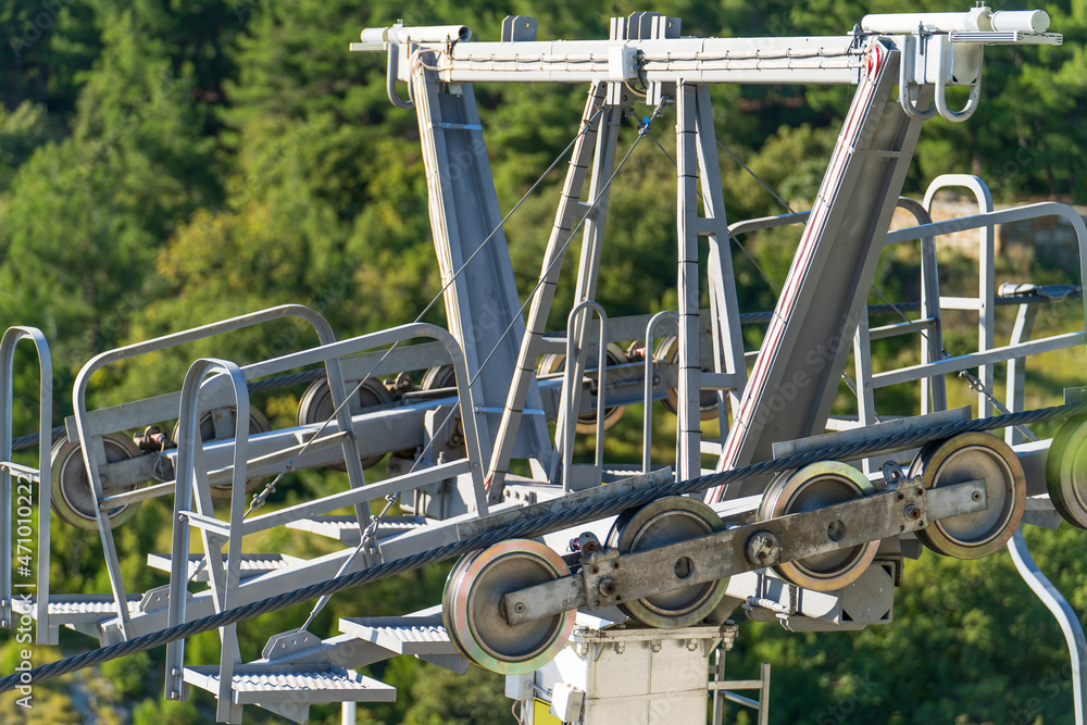 Roller ski lift cable system. Ropeway or cableway or Cable car in mountains.