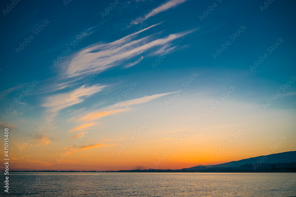 Obraz premium Sunset on the background of bright blue sky