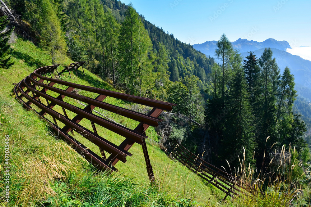 Metal avalanche barriers on the lower slopes Monte Morgenleit near Sauris di Sopra, Udine Province, Friuli-Venezia Giulia, north east Italy. Late September
Metal avalanche barriers on the lower slopes Monte Morgenleit near Sauris di Sopra, Udine Province, Friuli-Venezia Giulia, north east Italy. Late September