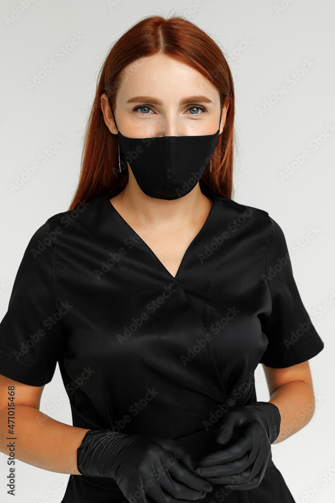 Pretty redhead sugaring master in black robe and mask Pretty redhead sugaring master in black robe and mask