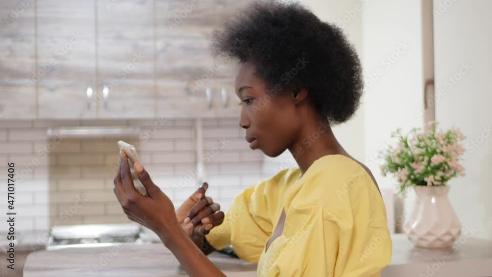 beautiful African American woman uses mobile phone, Internet, communication with friends, online social networks. selfie photo on smartphone beautiful African American woman uses mobile phone, Internet, communication with friends, online social networks. selfie photo on smartphone