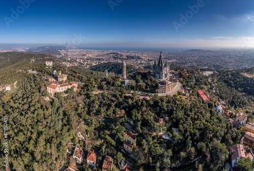 Drone panorama over Catalan metropolis Barcelona taken from Tibidabo direction during the day photo