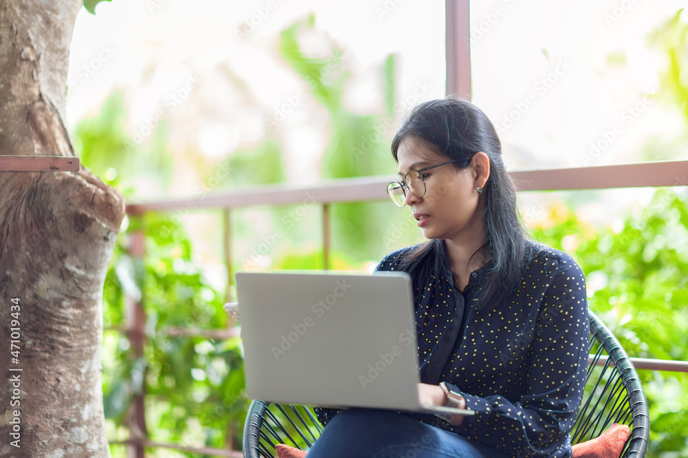 Asian women freelancer typing on laptop and work outside the office. Distance work through internet concept.selective focus. Asian women freelancer typing on laptop and work outside the office. Distance work through internet concept.selective focus.